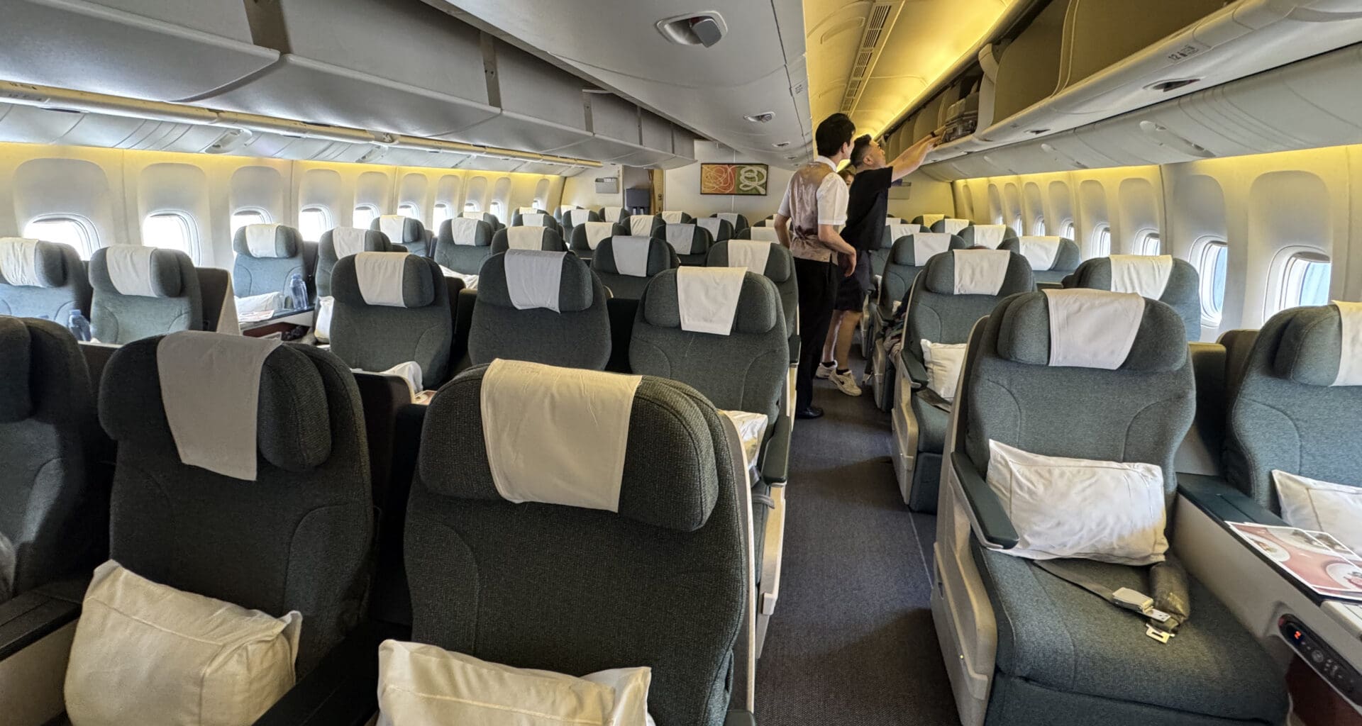 a couple of people standing in an airplane