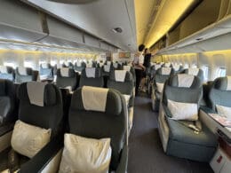 a couple of people standing in an airplane