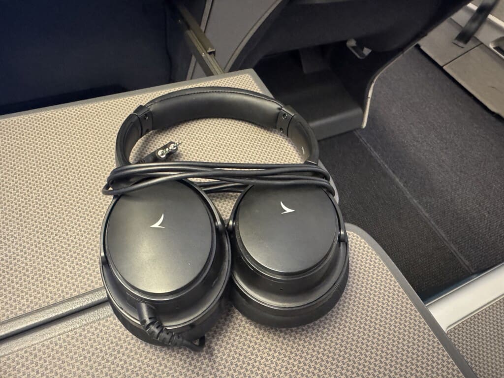 a pair of black headphones on a chair