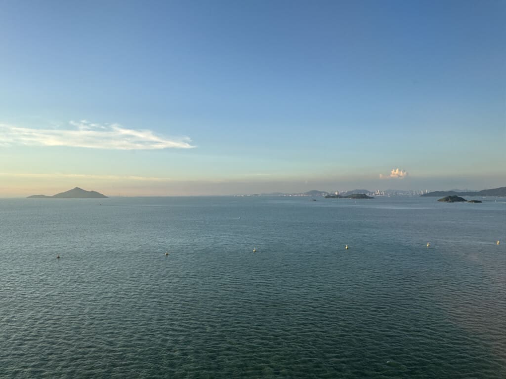 a large body of water with islands in the distance