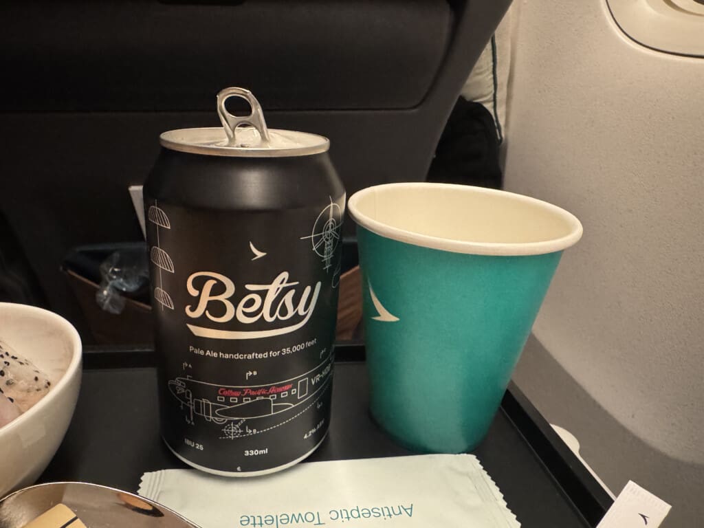 a can and a cup on a tray