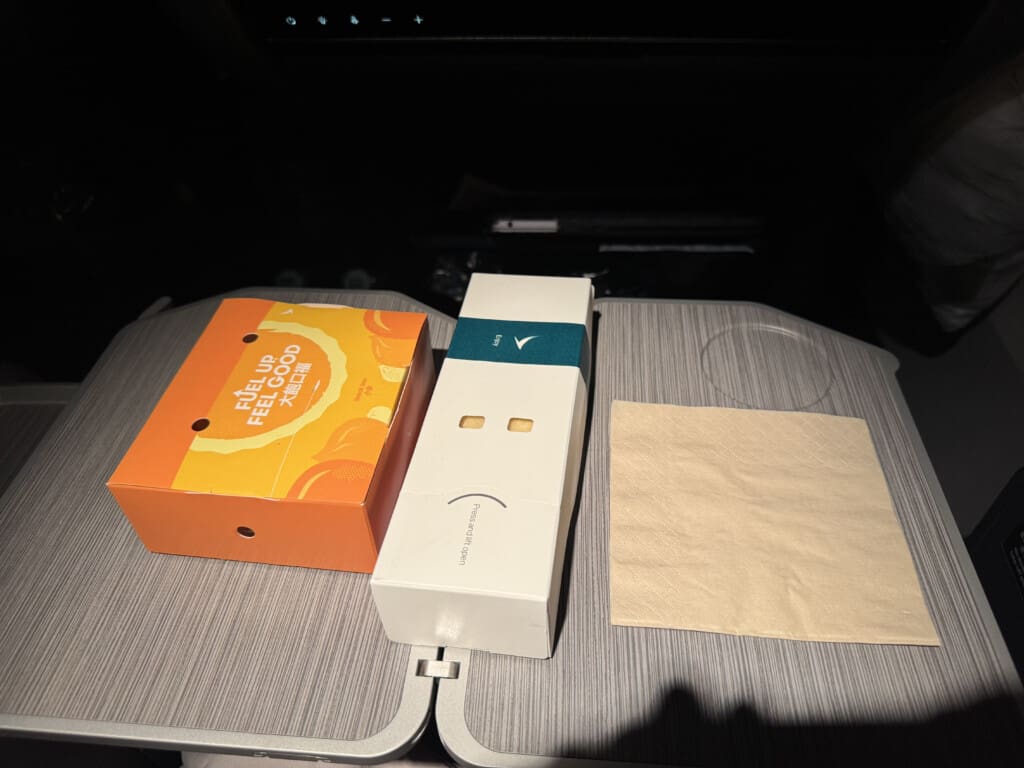 a box and napkin on a table