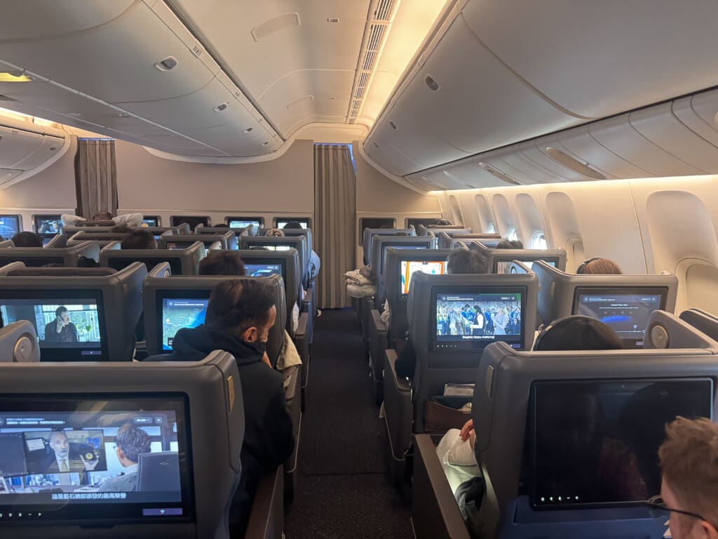 a group of people sitting in an airplane