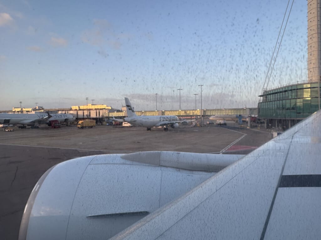 an airplane wing and wing of an airplane on a runway