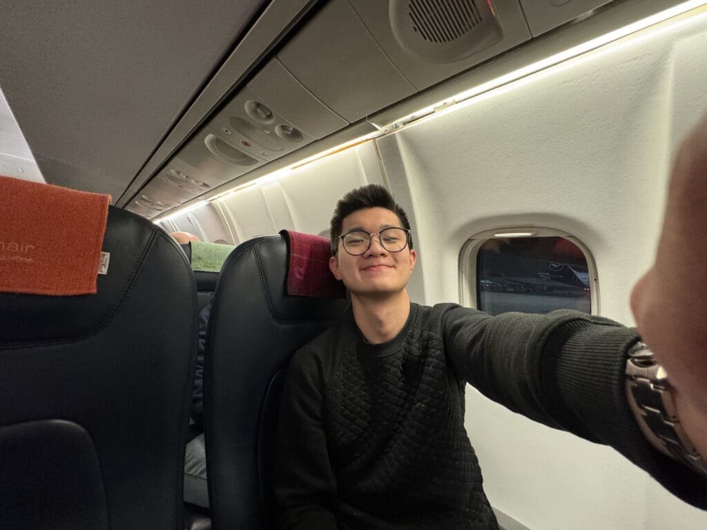 a man taking a selfie in an airplane