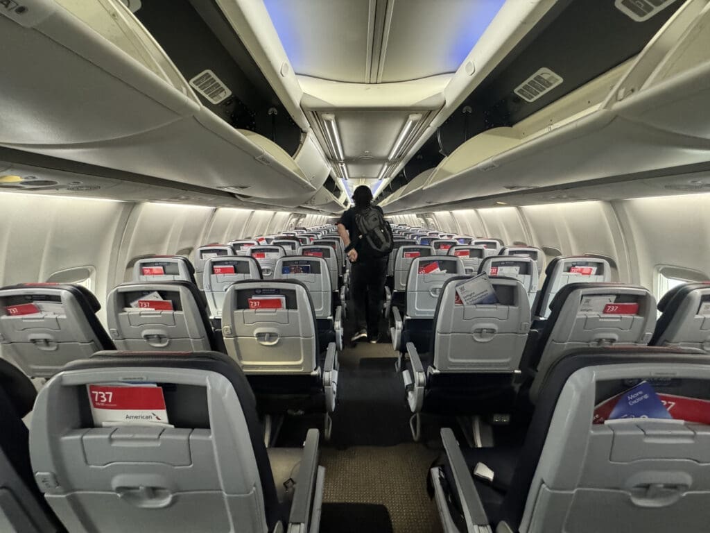 a person standing in an airplane