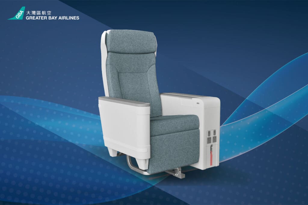a grey recliner chair with a blue background