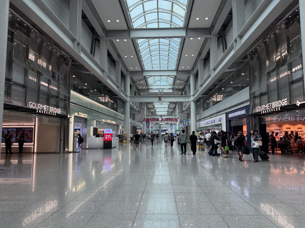 a large building with many people walking in it