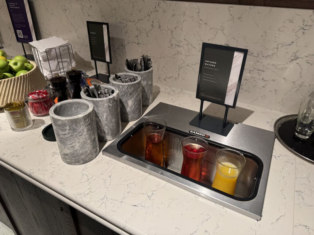 a counter with drinks in glasses