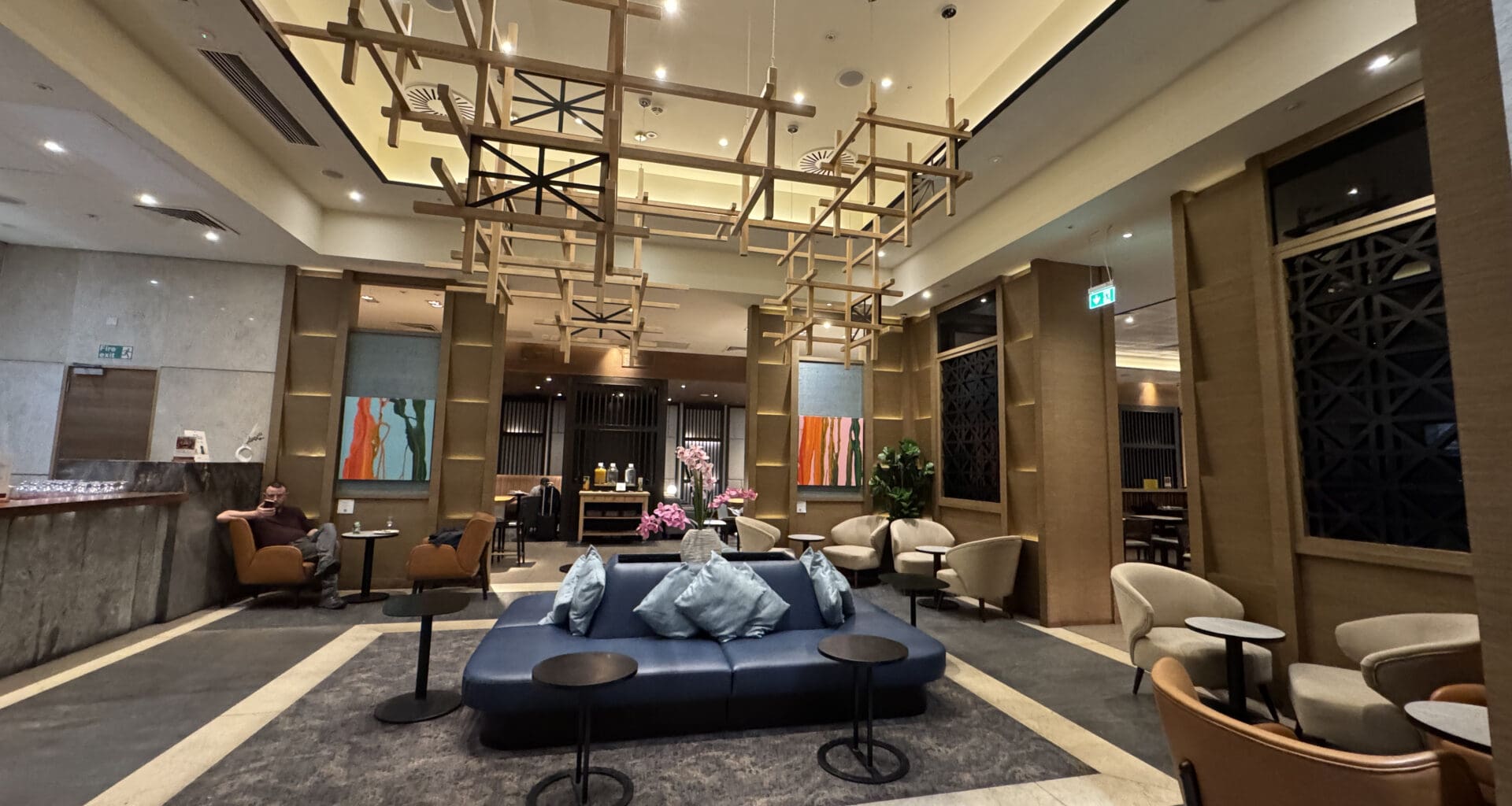 a room with a couch and chairs