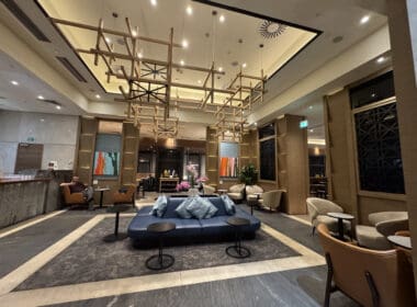 a room with a couch and chairs