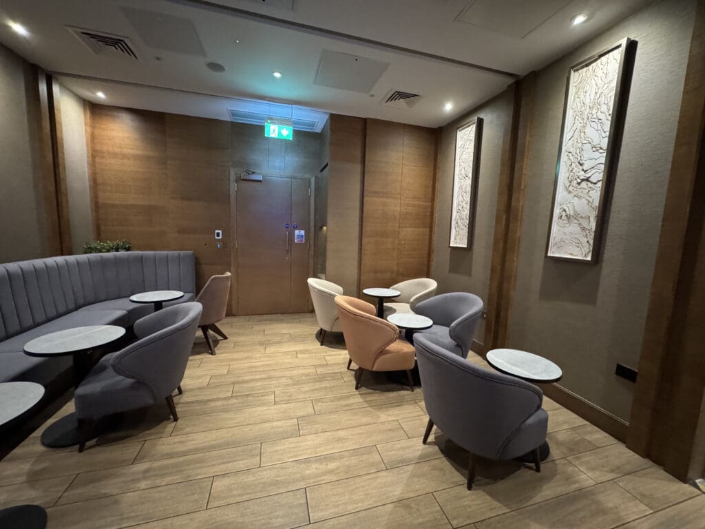 a room with a couch and tables