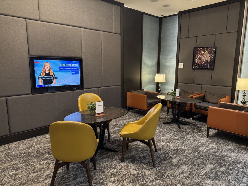 a room with a television and chairs