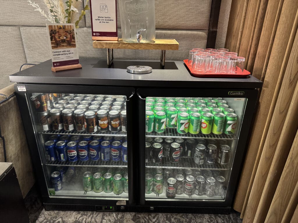 a glass case with drinks on it