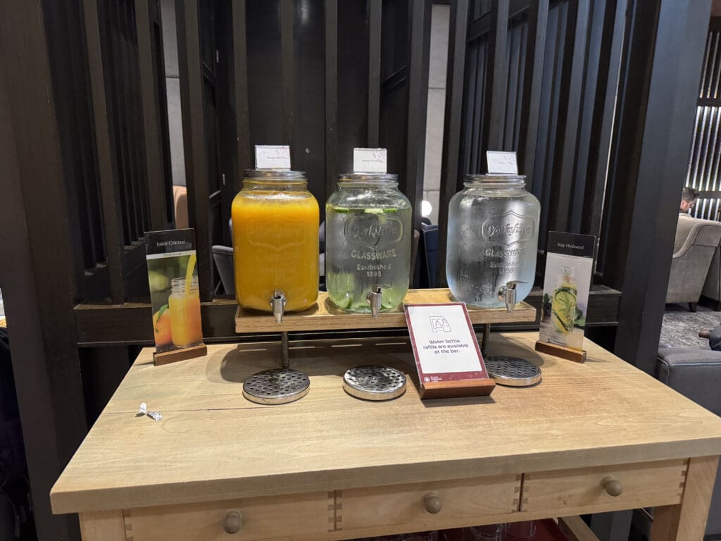 a group of glass jars with liquid on a table