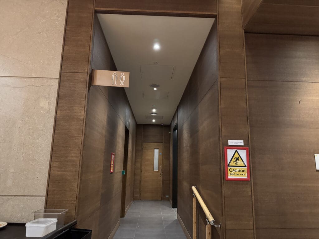 a hallway with a sign on the wall