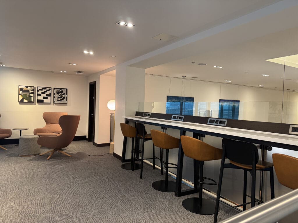 a room with a long table and chairs