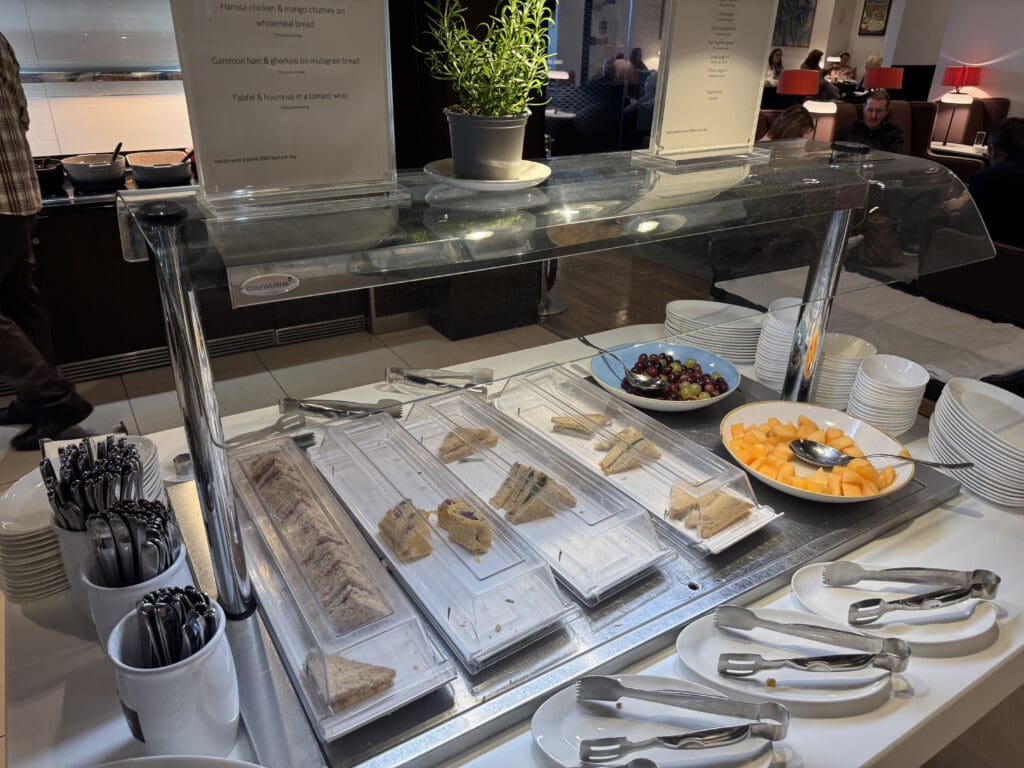 a buffet with food in plastic containers