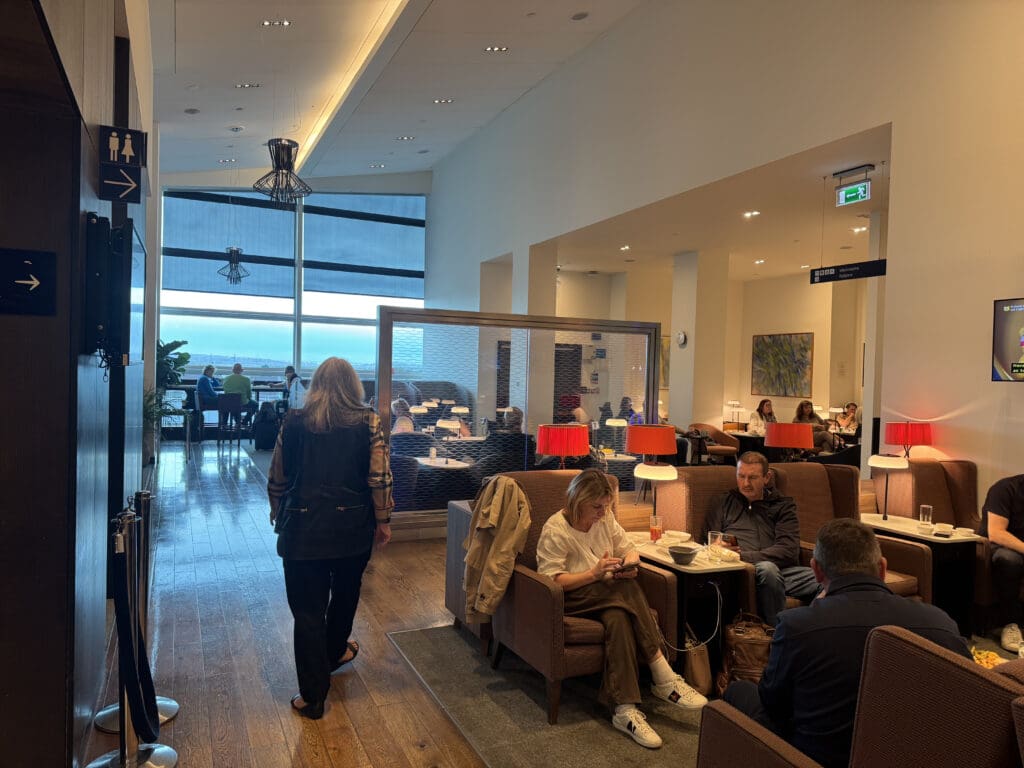 people sitting in a room with people in chairs