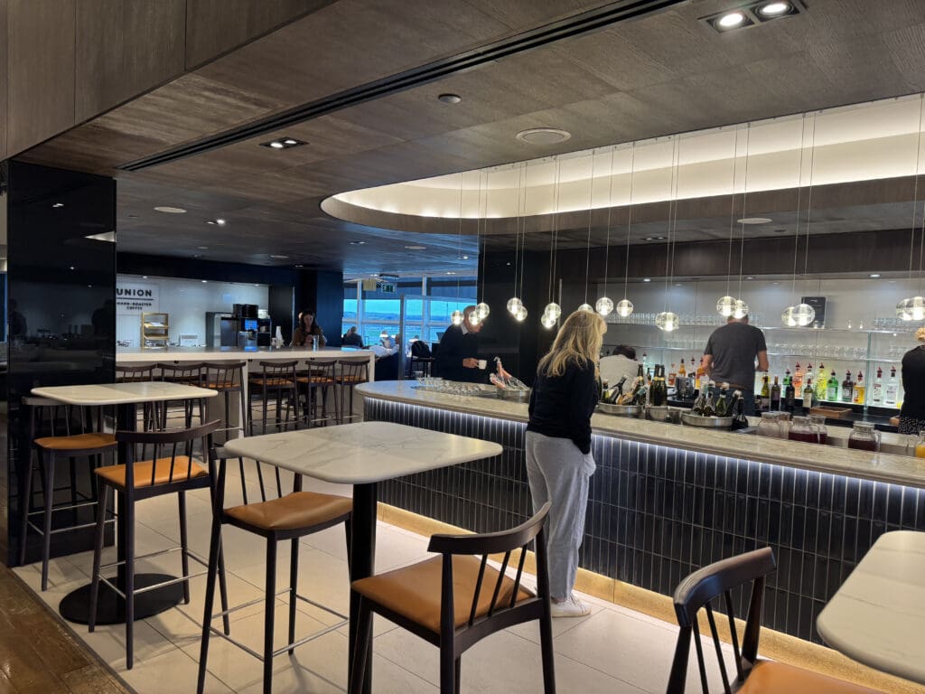 people standing at a bar