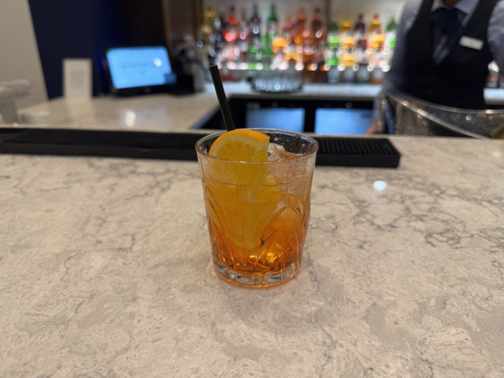 a glass with a drink and a straw