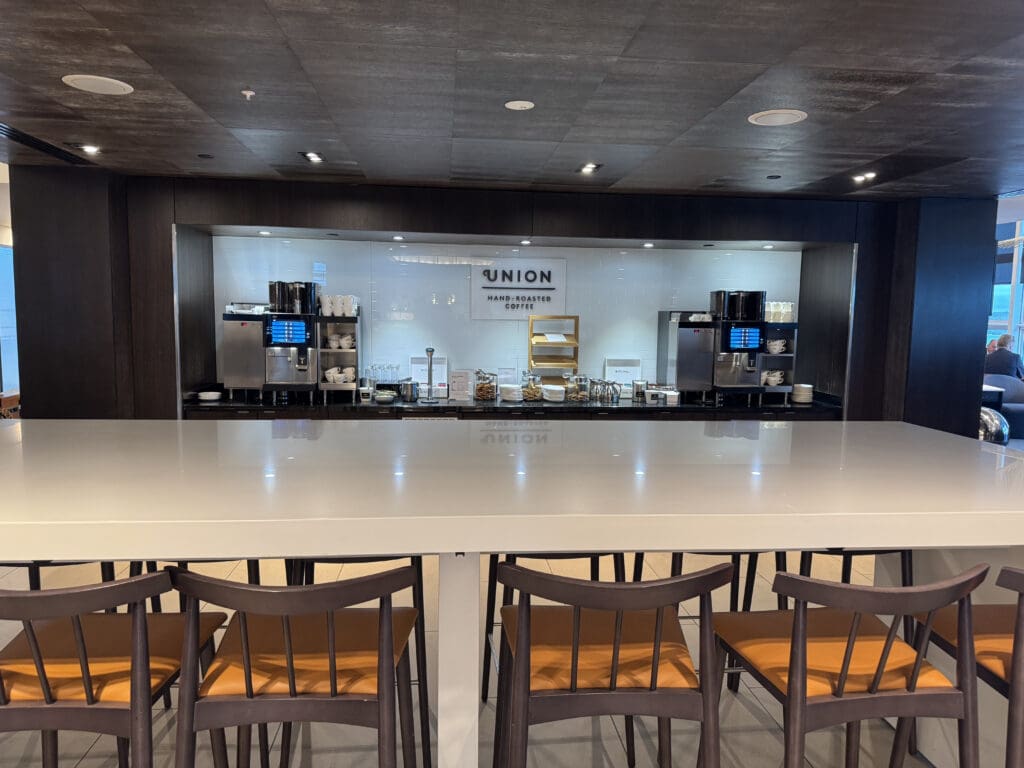 a table with chairs in front of a counter