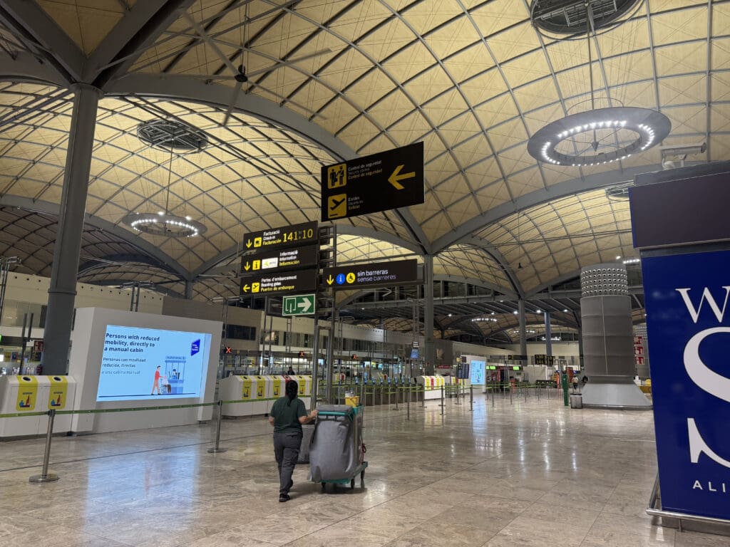 a person walking in a large airport terminal