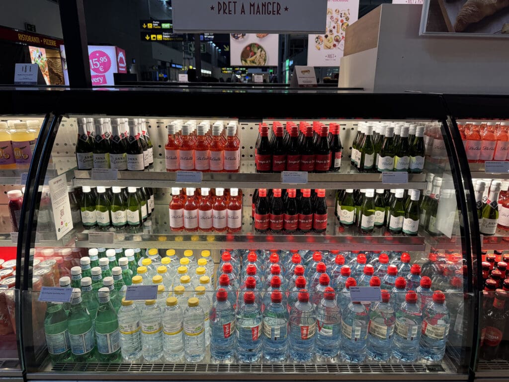 a display case with bottles of liquid