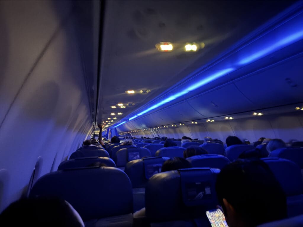 a plane with blue seats and lights