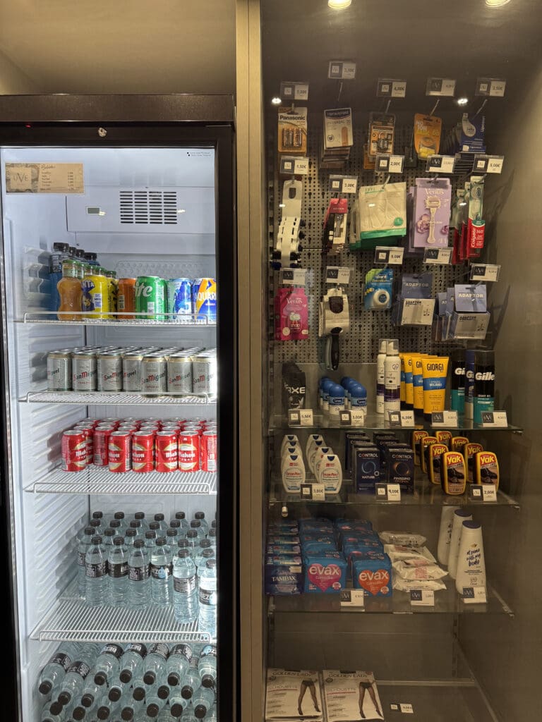 a refrigerator with drinks and beverages on shelves