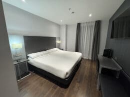 a room with a bed and a tv