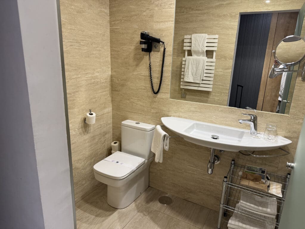 a bathroom with a sink and mirror