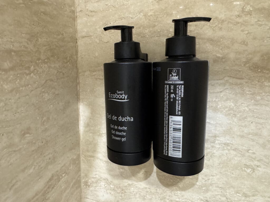 a couple of black plastic bottles with white text on them