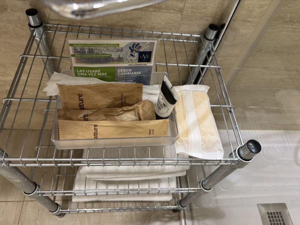 a bathroom items on a metal shelf