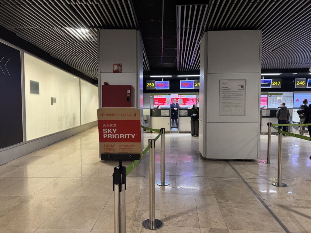 a group of people standing in a line in a airport
