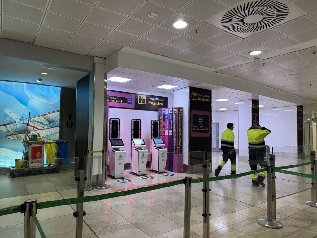 a group of people standing in a line in a building