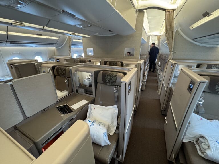 a person standing in the middle of an airplane