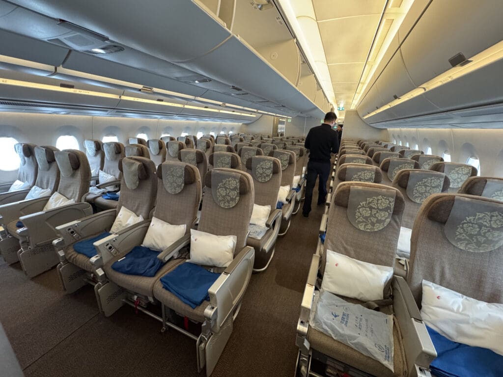 a man standing in a row of seats