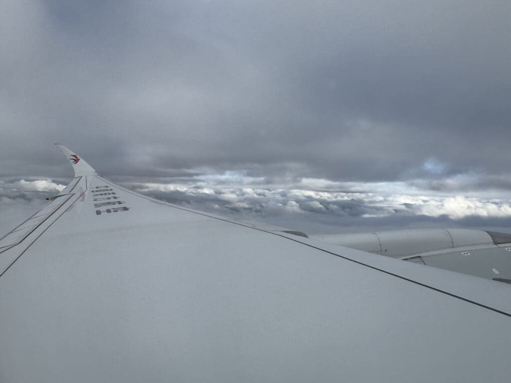 an airplane wing in the sky