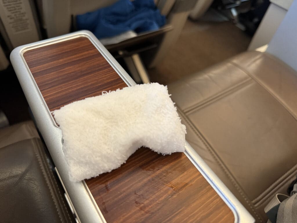 a white towel on a wooden surface