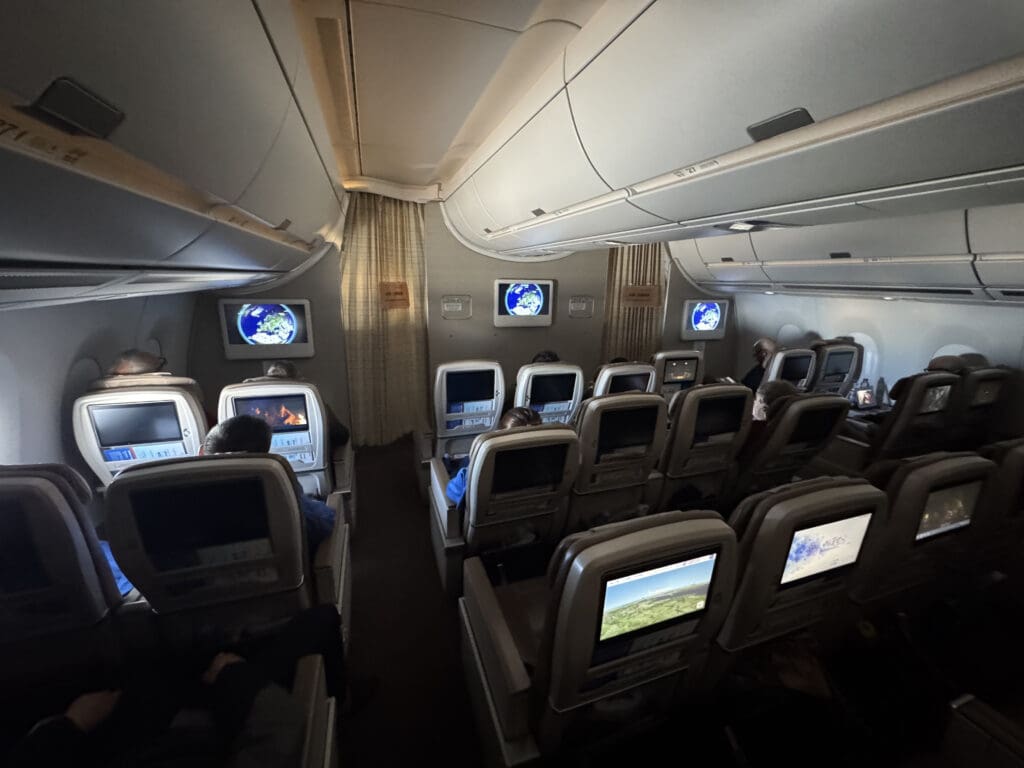 a group of people sitting in an airplane
