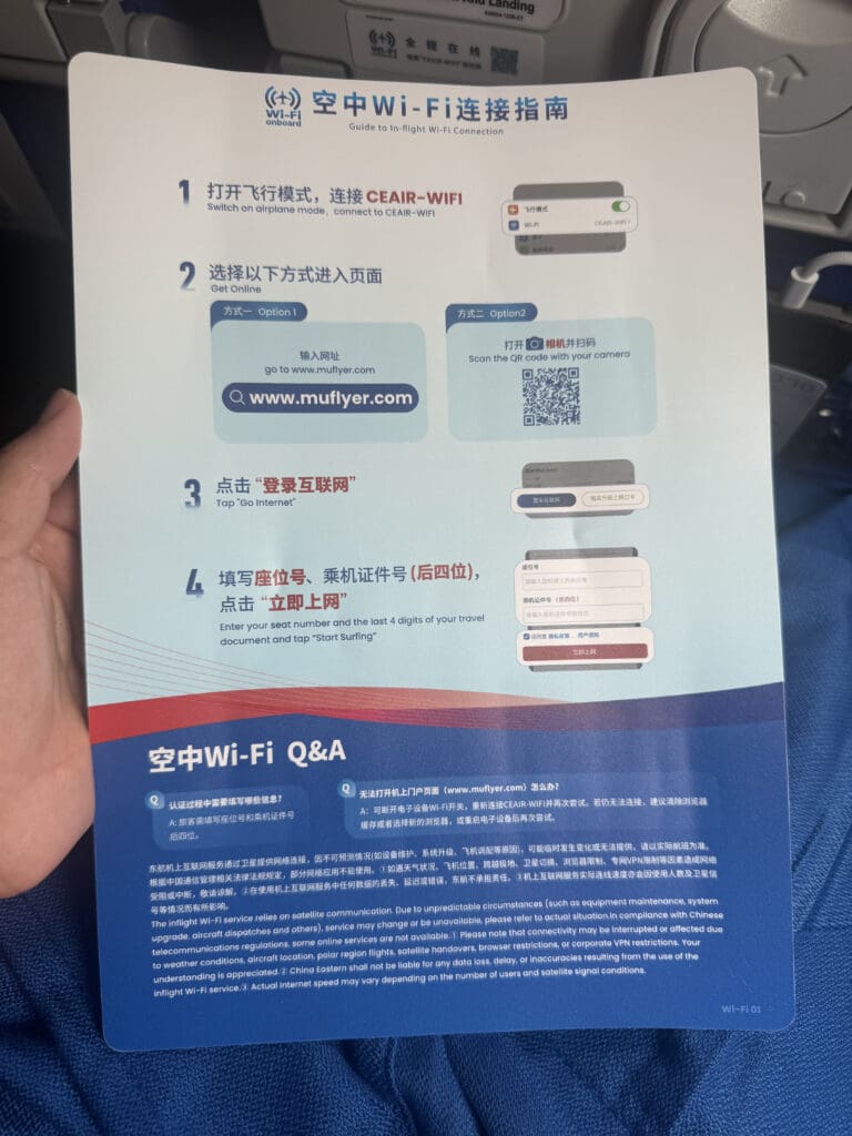 a hand holding a paper with text