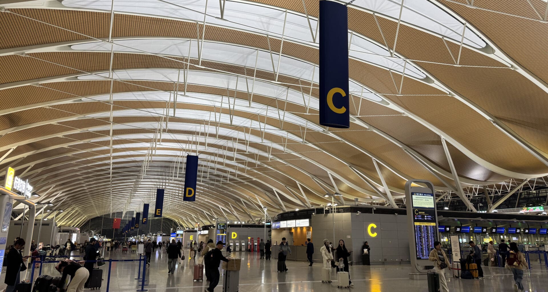people walking in a large airport