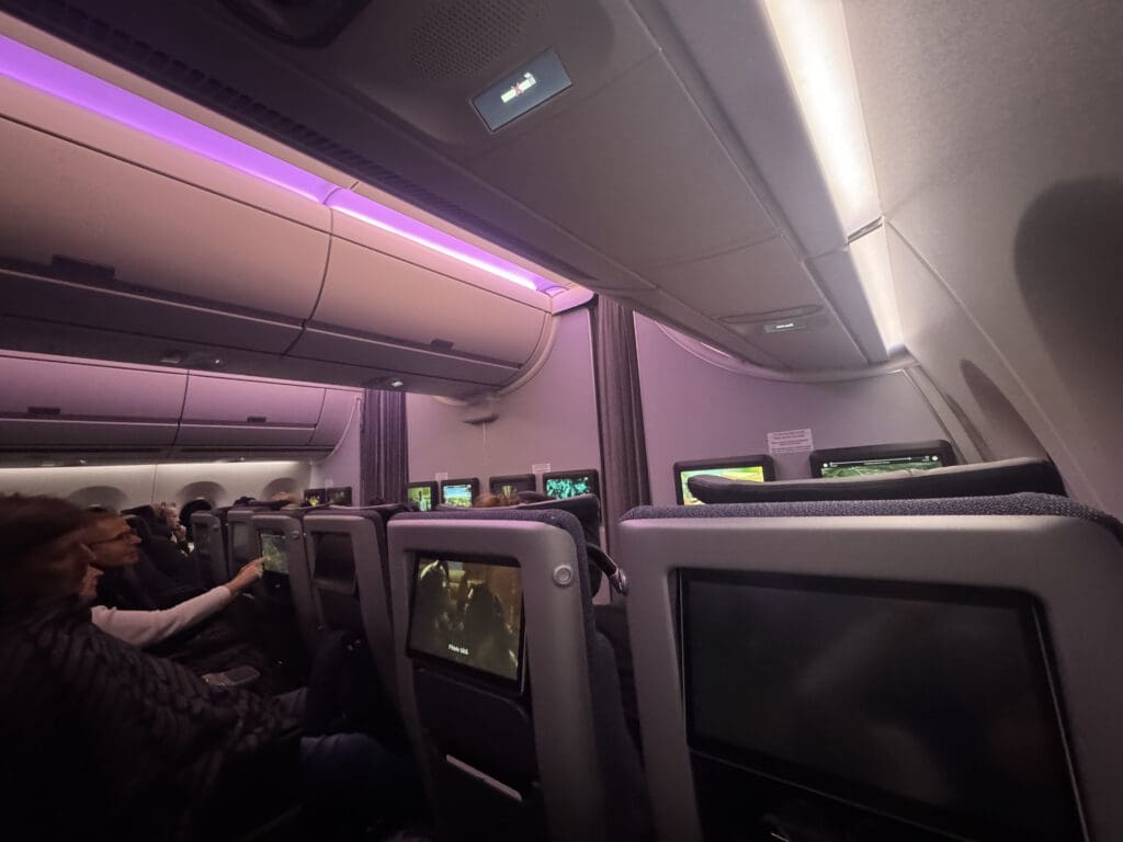 a group of people sitting in an airplane