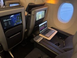 a laptop on a table in an airplane