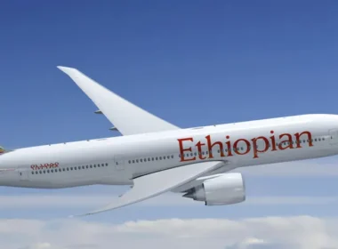 a white airplane flying in the sky