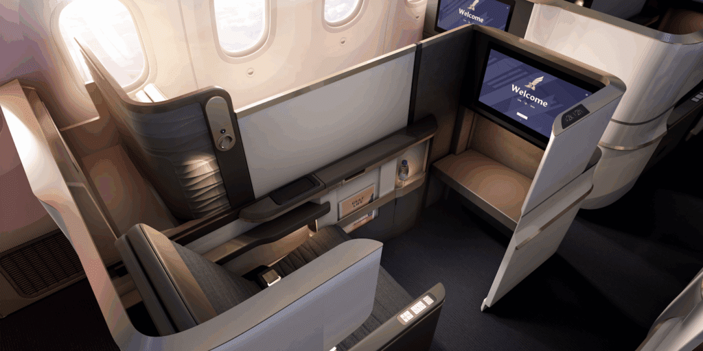 a seat and a tv in a plane