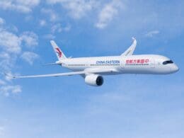 a white airplane in the sky