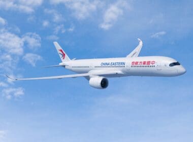 a white airplane in the sky