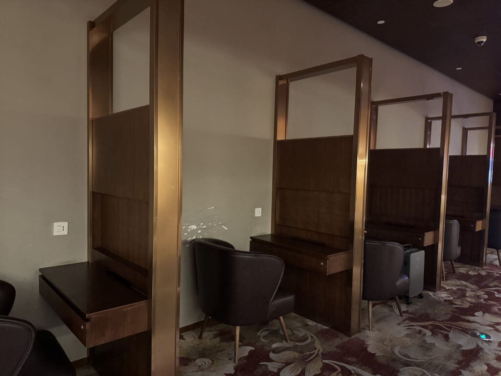 a room with a few chairs and a desk